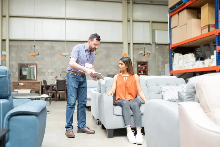 business wholesale furniture warehouse employee servicing a client